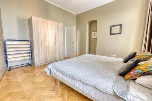 a bedroom with a bed with pillows on it at Historic Residence Apartments at Old Town in Tallinn