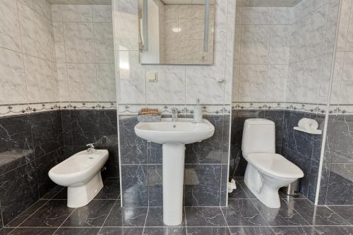 a bathroom with a sink and a toilet at Historic Residence Apartments at Old Town in Tallinn