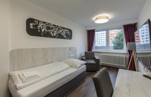 Postel nebo postele na pokoji v ubytování Hotel Garni VŠB TUO