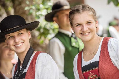 two young women are smiling for a picture at Ferienhus Klus 415 in Mellau