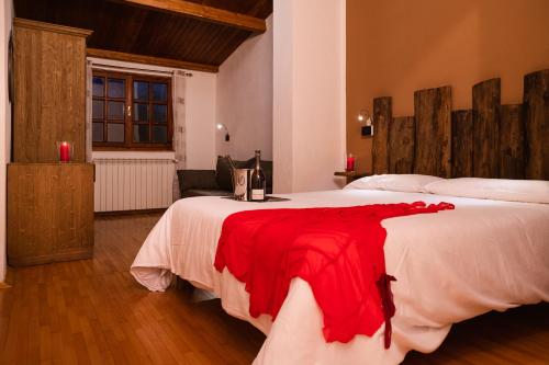a bedroom with a bed and a dresser at Hotel Sole in Prato Nevoso
