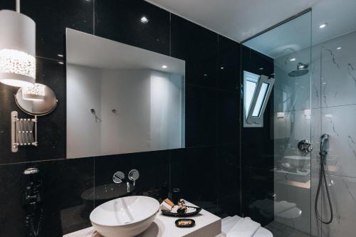 a bathroom with a toilet and a shower and a sink at Seascape Luxury Residences in Agia Pelagia