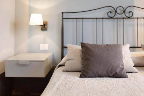 Katil atau katil-katil dalam bilik di Victoria Apartments Tempi moderni