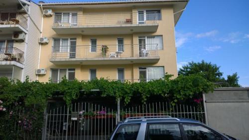 a building with a car parked in front of it at House of Flowers in Ahtopol