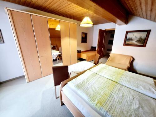a bedroom with a bed with a map on it at Guesthouse Schoba Typ D in Kirchbach