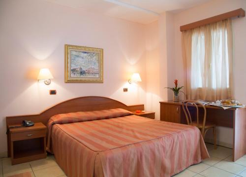 Postel nebo postele na pokoji v ubytování Garden Hotel Ripa