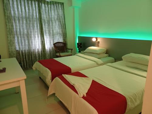 Krevet ili kreveti u jedinici u okviru objekta Beach Grand & Spa Premium