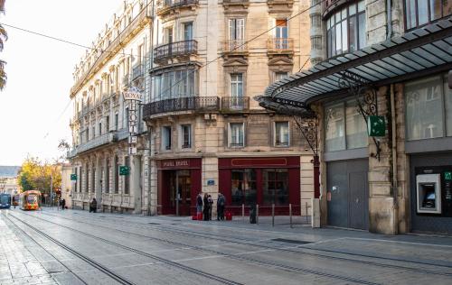 a large building on a city street with at Hôtel Royal in Montpellier