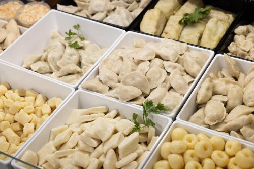 a bunch of different types of food in white boxes at Willa 777 Krasickiego in Międzyzdroje