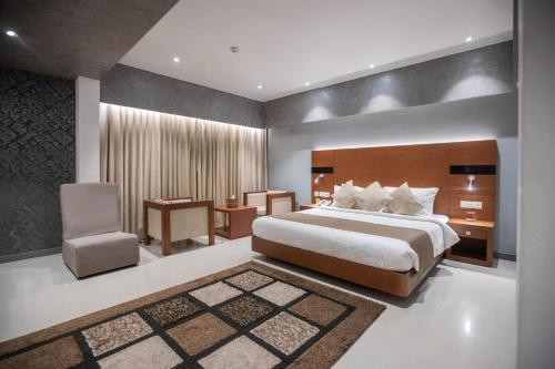 Postel nebo postele na pokoji v ubytování Hotel Niya Regency
