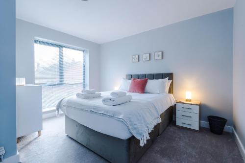 a bedroom with a large bed and a window at Cestrian House in Chester