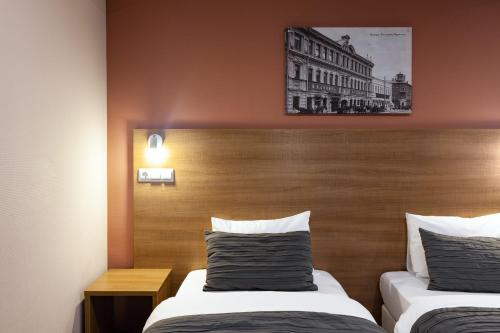 Posteľ alebo postele v izbe v ubytovaní Hotel Furor