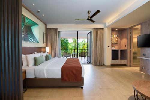 Postel nebo postele na pokoji v ubytování Amoravida By 7 Apple Resorts, Goa