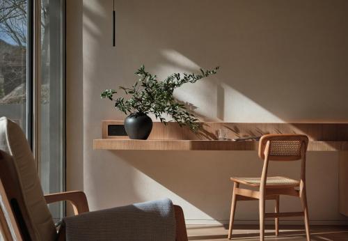 a room with a counter with a vase with a plant on it at Commune by the Great Wall, in the Unbound Collection by Hyatt in Yanqing
