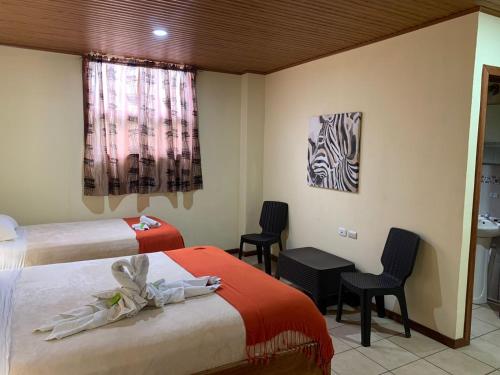 Ένα ή περισσότερα κρεβάτια σε δωμάτιο στο Hotel Casa Madonna