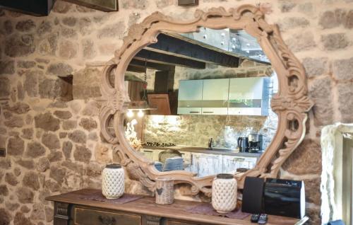 a large mirror sitting on a table in a kitchen at Holiday Home Marko in Trilj
