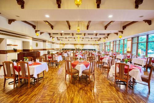 a dining room with tables and chairs in it at Clarks Khajuraho in Khajurāho