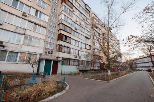 an empty street in front of an apartment building at CityApartments Kyiv Obolon in Kyiv