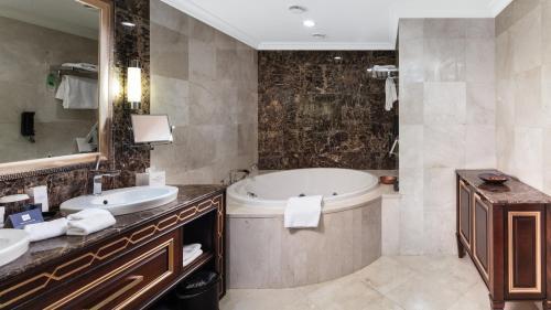 a bathroom with two sinks and a tub at Crowne Plaza Istanbul Asia by IHG in Istanbul