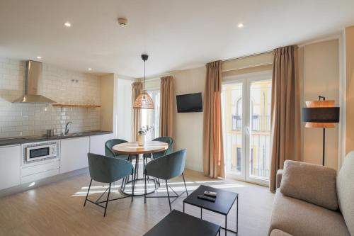 Kuchyň nebo kuchyňský kout v ubytování Apartamentos Magna Sevilla