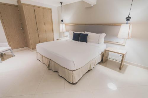Ένα ή περισσότερα κρεβάτια σε δωμάτιο στο Hotel Santa Cecilia B&B
