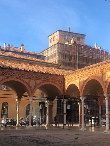 a large building with a building under construction at MyRoom sui Portici in Bologna