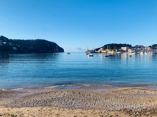 a view of a body of water with a beach at Hotel Miramar in Port de Soller