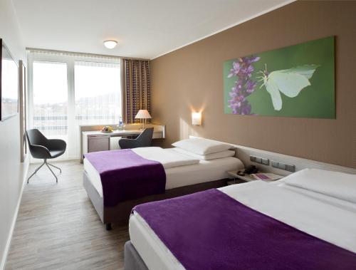 Mercure Hotel Hameln 객실 침대