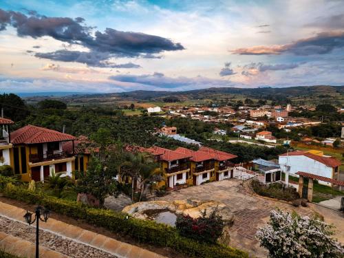 a view of a town with houses and trees at Hotel Las Rocas Resort Villanueva in Villanueva