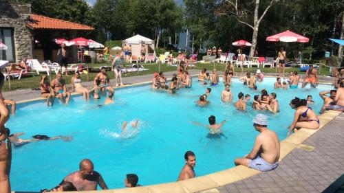 a large group of people in a swimming pool at LOCANDA MIRABEAU in Bellagio