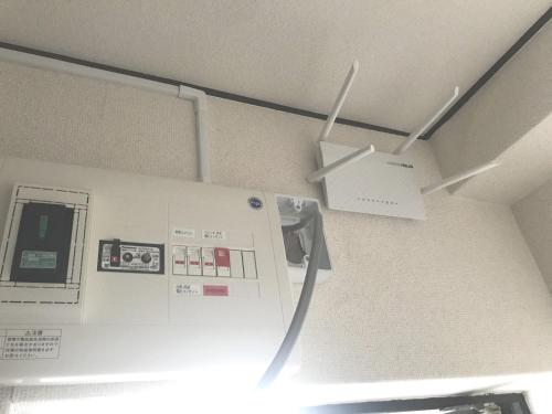 a white refrigerator in a kitchen with a ceiling at Simple Stay Beppu in Beppu