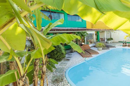 a resort with a swimming pool and a building at Taverna do Paraiso in Janga