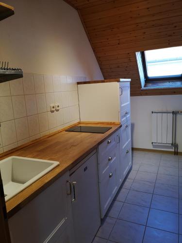 a kitchen with a sink and a counter top at Csokoládé in Hévíz