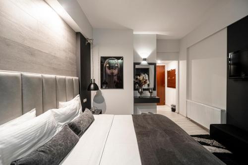 a bedroom with a large bed in a room at Lingos Hotel in Florina