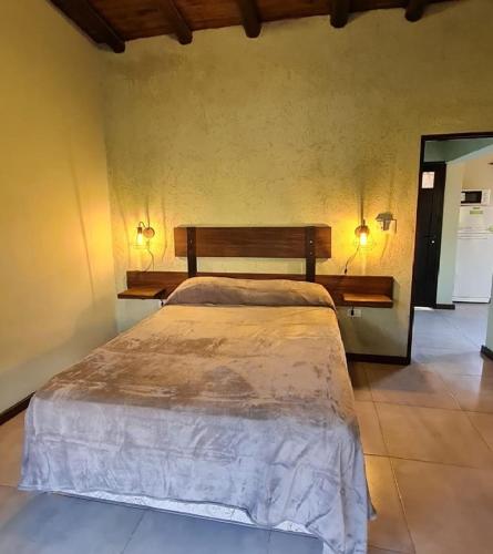 a bedroom with a large bed in a room at Cabañas Altos de San Blas in San Javier