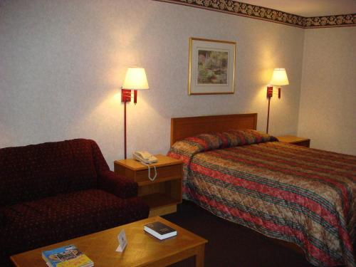 Ένα ή περισσότερα κρεβάτια σε δωμάτιο στο Americas Best Value Inn & Suites Macon