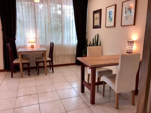 a dining room with a table and chairs at Quito Terrace in Quito