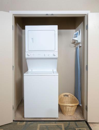 a washer and dryer in a closet at The Platinum Hotel in Las Vegas