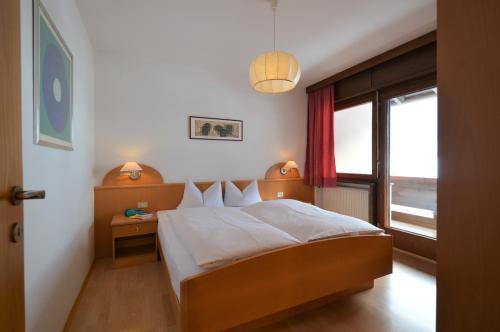 Un pat sau paturi într-o cameră la Residence Albierch