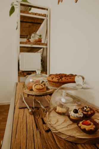 a table with some pastries and cakes on it at BED and BREAKFAST il Duomo in Ascoli Piceno