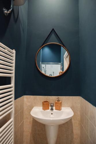 a bathroom with a sink and a mirror at BED and BREAKFAST il Duomo in Ascoli Piceno