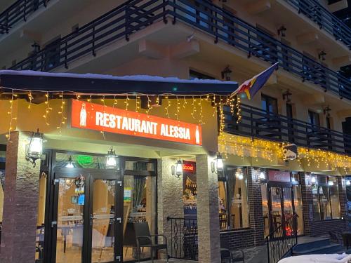 a restaurant with a sign on the front of a building at Hotel Restaurant Alessia in Ranca