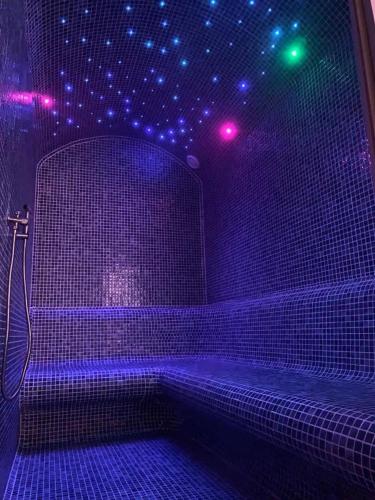 a purple room with purple lights on a wall at WALD Apartmani&SPA in Zlatibor