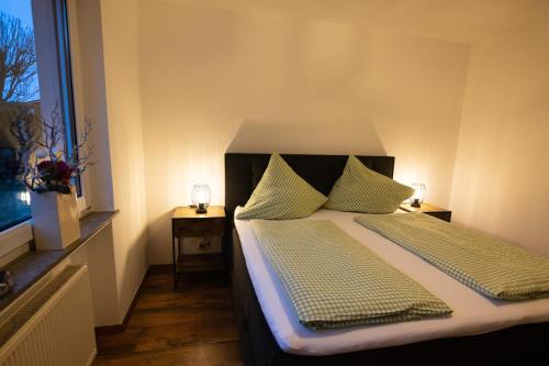 Ένα ή περισσότερα κρεβάτια σε δωμάτιο στο Landhaus am Itterbach Willingen