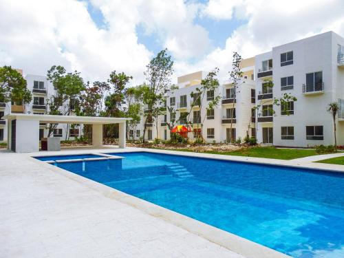 an image of a swimming pool in front of a building at Franks House "Shared House" Apartment in Cancún