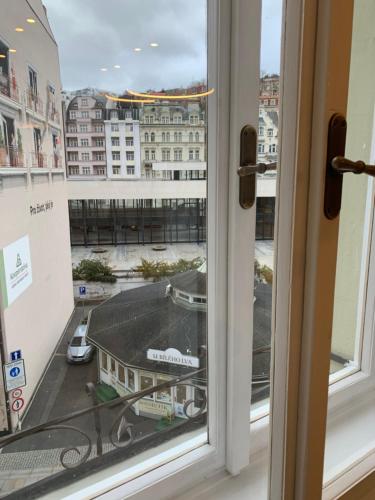 a window with a view of a city at Bella Vista Collonade in Karlovy Vary