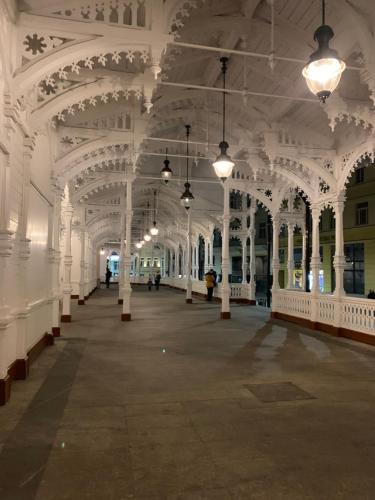 a large white building with white columns and ceilings at Bella Vista Collonade in Karlovy Vary