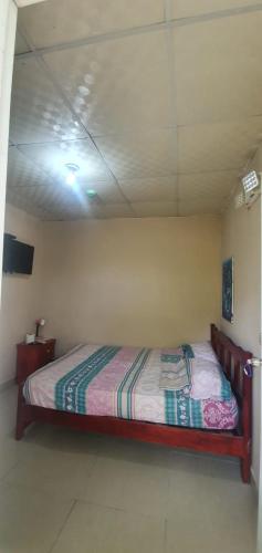 a bedroom with a bed in a room at Hostal Brisas Calobrenas in Calobre