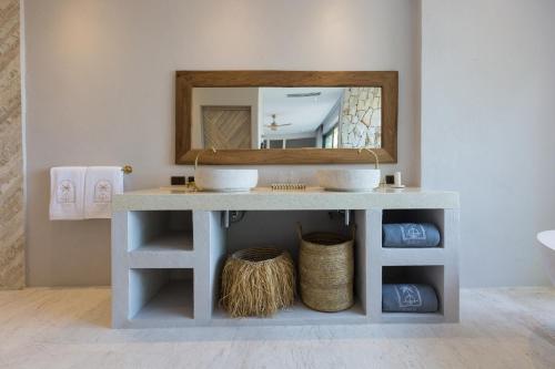 a bathroom vanity with a mirror and a sink at Cielo Boutique Hotel & Spa Samui in Bophut 
