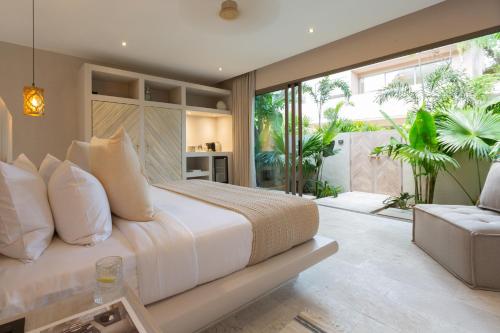 a bedroom with a large bed and a large window at Cielo Boutique Hotel & Spa Samui in Bophut 